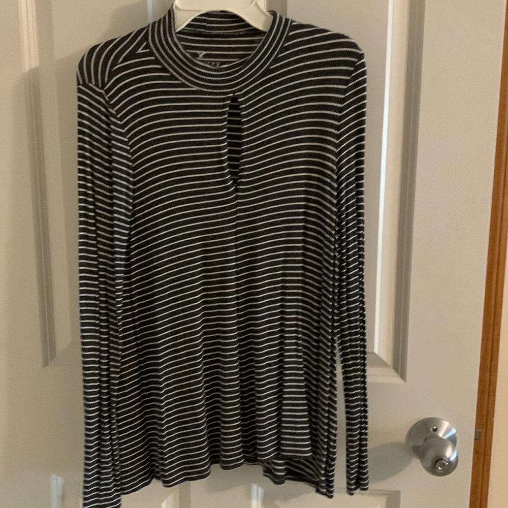 Black and white striped long sleeve with slit in the chest